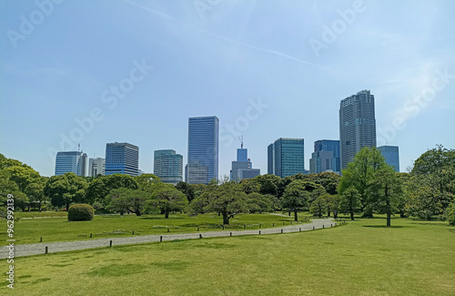 Hamarikyu Gardens surrounded by skyscrapers of Shiodome Section in Tokyo, Japan
