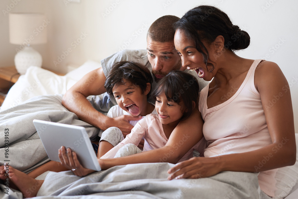 Family, selfie and tablet on bed for playful, relax and live streaming together with video and app. Parents, silly and children as people in home bedroom for film, social media and memory on weekend Family, selfie and tablet on bed for playful, relax and live streaming together with video and app. Parents, silly and children as people in home bedroom for film, social media and memory on weekend