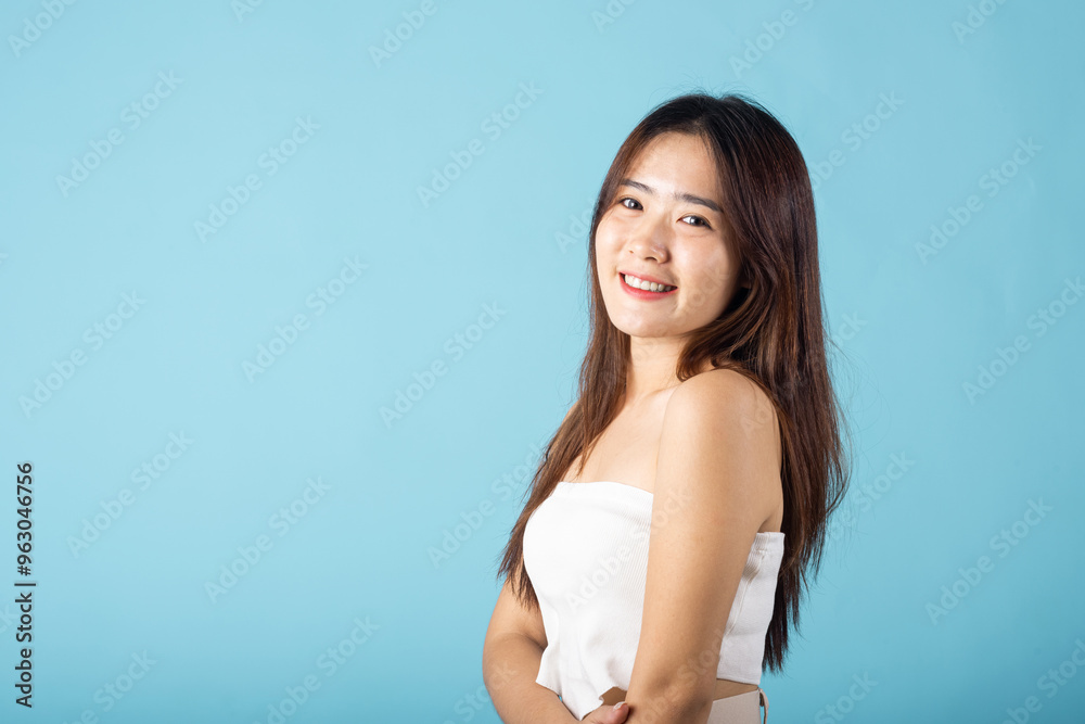 Skin care and Beauty concept. Portrait happy woman with natural makeup and healthy face studio shot isolated on blue background, Asian young female with beauty face touching healthy facial skin Skin care and Beauty concept. Portrait happy woman with natural makeup and healthy face studio shot isolated on blue background, Asian young female with beauty face touching healthy facial skin
