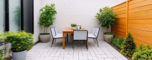 Small patio with work, dining, and relaxation spaces, multifunctional and airy photo