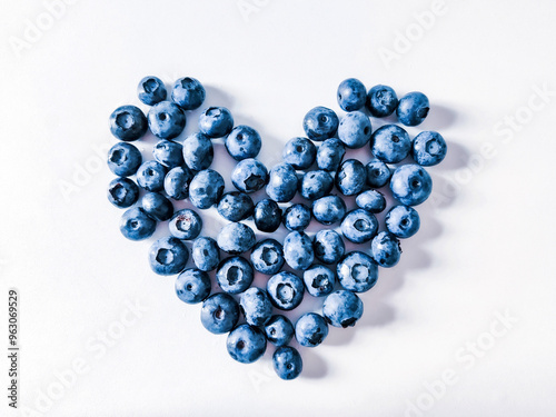 Blueberries  heart on white background photo