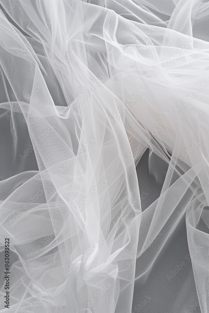 Close-up view of white fabric with subtle sheen and slightly wrinkled texture. Fabric set against gray background highlights intricate details. Perfect for fashion, textile, or design projects. Close-up view of white fabric with subtle sheen and slightly wrinkled texture. Fabric set against gray background highlights intricate details. Perfect for fashion, textile, or design projects.