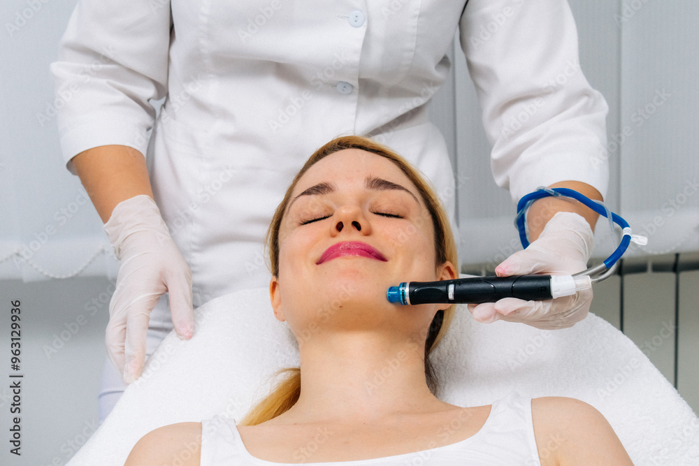 A dermatologist performs a hydro peel facial, highlighting advanced skin therapy for rejuvenation. Ideal for showcasing effective cosmetic enhancement and esthetic procedures.