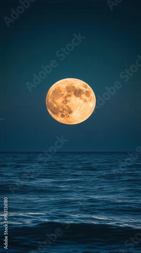 Dramatic moonrise over ocean horizon