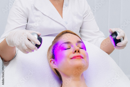 Close-up of a woman undergoing LED therapy for skin rejuvenation in a cutting-edge aesthetic clinic. Showcases non-invasive phototherapy as an effective beauty solution. photo