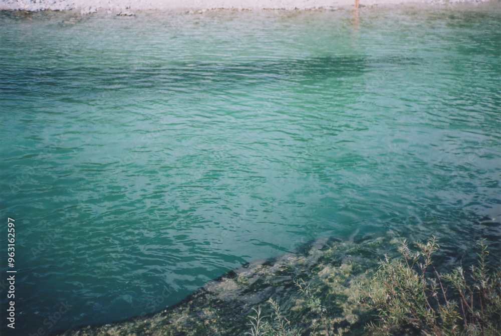 Obraz premium Detail of Beautiful Turquoise Water of Soča River during a Sunny SummerDay. Tolmin Province, Slovenia. Film Photography