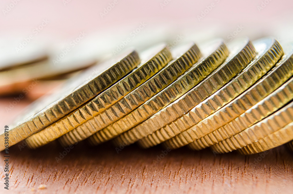 Fototapeta premium Close up of golden coins suitable for advertisement, slide presentation relating to financial etc