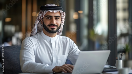 Portrait of young arab businessman inside office man typing on laptop smiling boss happy with results of financial success at workplace : Generative AI