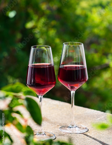 Two glasses with alcoholic cocktail, red wine. Tasty drink. Winery production. Delicious beverage