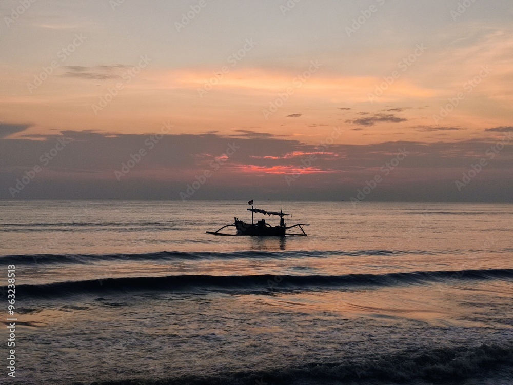 a fishing boat anchored on the north coast of Java, Indonesia with a sunrise atmosphere a fishing boat anchored on the north coast of Java, Indonesia with a sunrise atmosphere