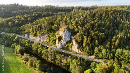 Aerial footage of circle over road and famous rock (Gespaltener Fels) at the Danube River near Sigmaringen