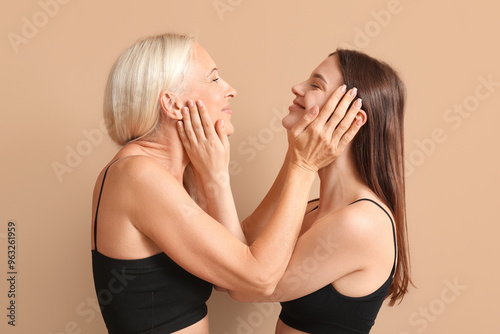 Body positive women hugging...