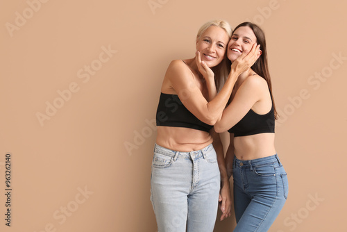Body positive women hugging...