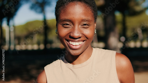 Close-up of happy young woman outdoors in the park
