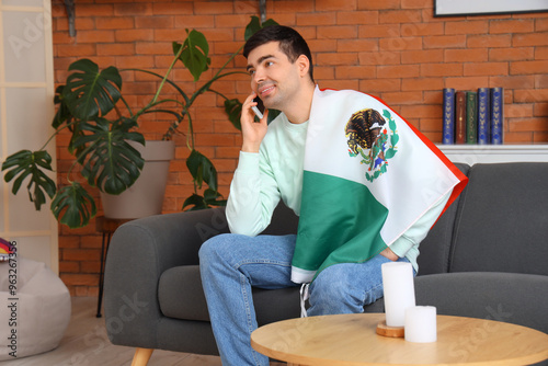 Young man with Mexican flag...
