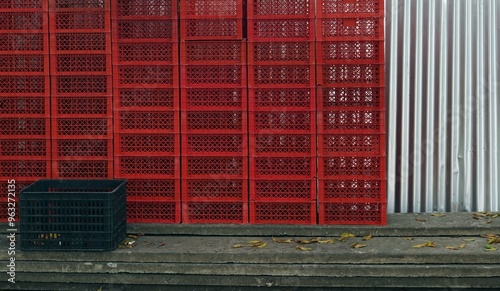 A many baskets of fruit lined up in the wholesale market to preparing package.