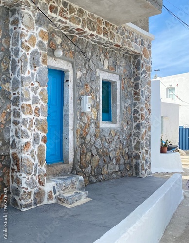 Greek house, with the classic blue and white colours and bricks photo