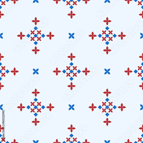 In this seamless pattern, a geometric pattern resembling a red four-petal flower is arranged alternating with blue diamonds in a bouquet on a white background. Beautifully decorated with blue flowers.