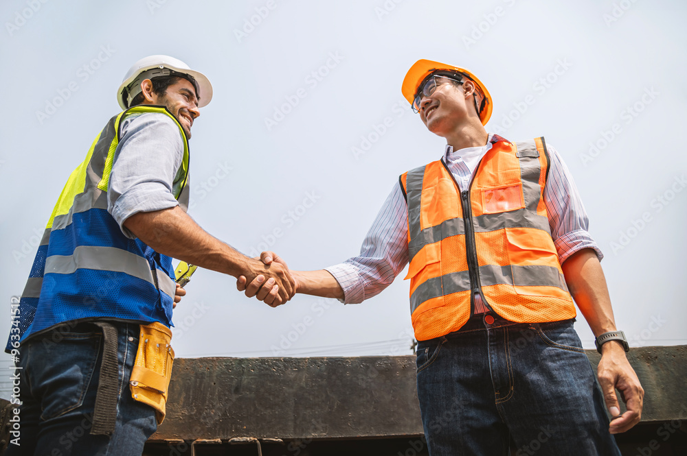 Collaboration of railway engineers from two nationalities, teamwork concept.
Collaboration of railway engineers from two nationalities, teamwork concept.
