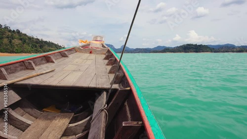 Side view on the nose of the boat on the Cheow Lan lake in Thailand