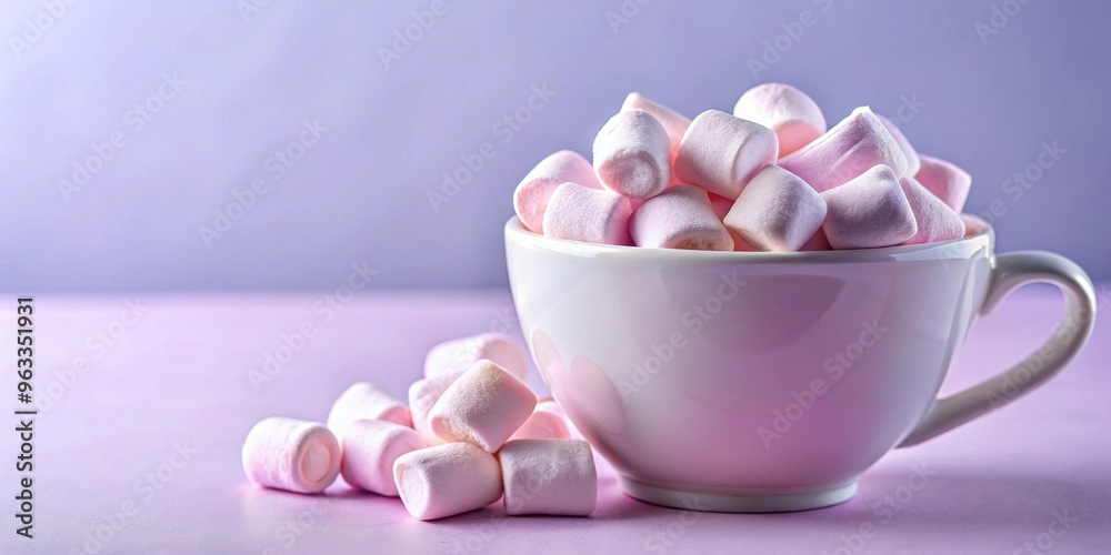 Airy pink marshmallows in a cup on a soft lilac background with copy space Airy pink marshmallows in a cup on a soft lilac background with copy space