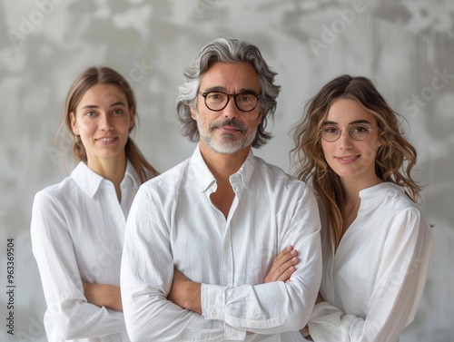 A team of colleagues displaying adoration, looking admirably at a leader in a minimalist office with a blank background, medium shot, soft lighting photo
