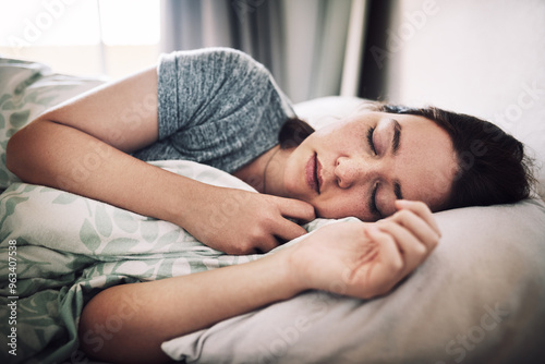 Woman, tired and sleeping in house for nap, relax and exhausted with peace, comfort and weekend rest in bed. Female person, fatigue and asleep in bedroom for break, morning and burnout with pillow