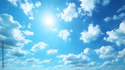 Vivid Blue Sky Photo with Fluffy White Clouds and Bright Sun