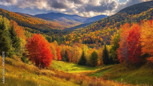 The Green Mountains of Vermont in the fall, with fiery red, orange, and yellow foliage covering the slopes