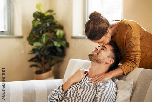 Tableau sur toile Sofa, couple and kiss on forehead for love, affection and bonding together in marriage at home