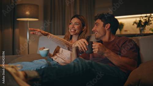 Excited family watch comedy movie have good time evening room together closeup
