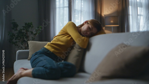 Tired woman sleeping sofa evening empty flat. Apathetic bored girl feeling sad