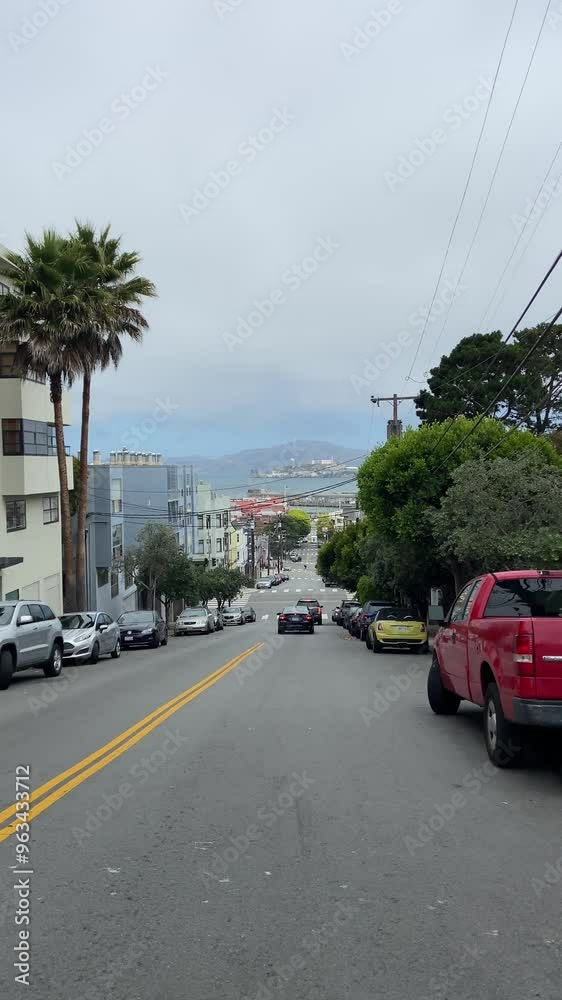 San Francisco, California, USA, June 29, 2022: SLOW MOTION SHOT - Alcatraz Island view from Leavenworth Street. San Francisco, California, USA, June 29, 2022: SLOW MOTION SHOT - Alcatraz Island view from Leavenworth Street.