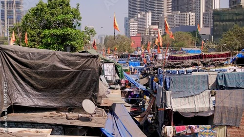 Dhobi ghat slums Mumbai, India, laundry area. The washers, known as dhobis, work in the open to clean clothes and linens from Mumbai's hotels and hospitals. photo