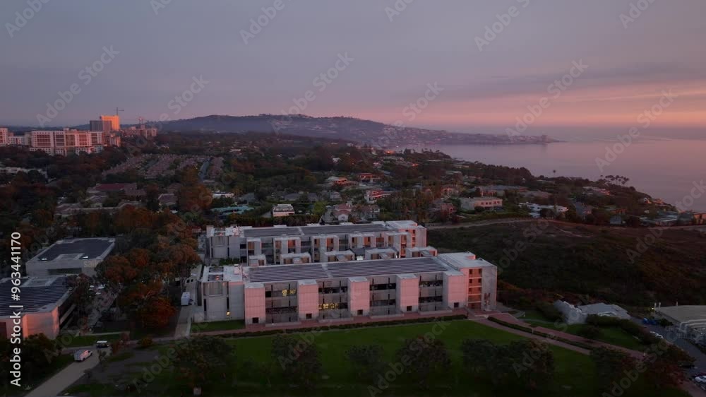 Aerial view of the Salk Institute in La Jolla during a colorful sunset with pink and purple sky and views of the Pacific Ocean Aerial view of the Salk Institute in La Jolla during a colorful sunset with pink and purple sky and views of the Pacific Ocean