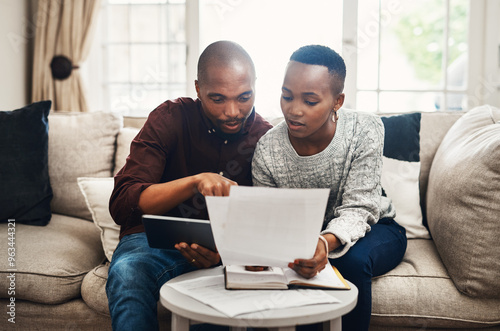 Photography Black couple, home and invoice on sofa with documents for bills, debt and loan interest rate
