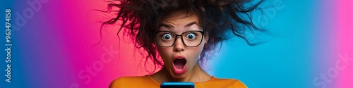 Photo of amazed shocked young woman looking at phone, fast internet, hair blown by wind, isolated on colorful neon background. 