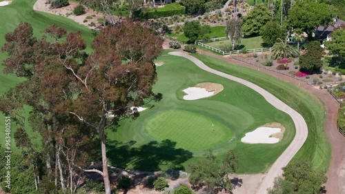 Aerial view of a luxury golf course in Rancho Santa Fe with views of the blue sky and luxury homes surrounding the area photo