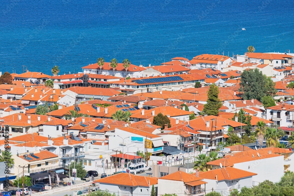 Obraz premium View of pefkochori town, greece with part sea view from hill
