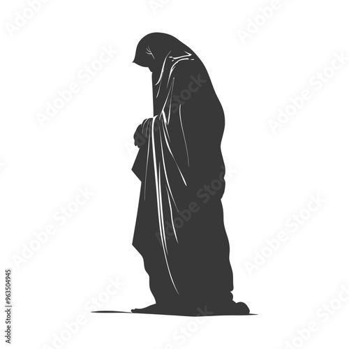 Silhouette of a woman in a long robe kneeling in prayer