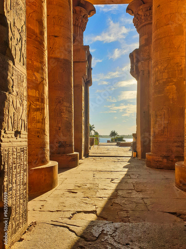 Picturesque view of the grand columns with reliefs with a view of the Nile river at the Temple of Sobek and Haroeris built in 2nd century BC by Ptolemy pharoahs in Kom Ombo,Near Aswan,Egypt