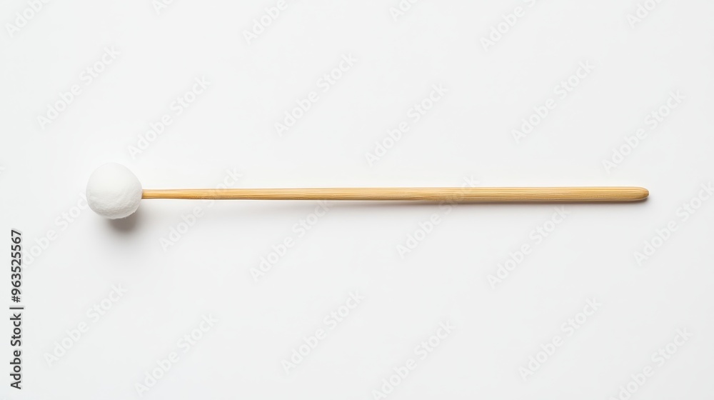 A single wooden mallet with a white head, isolated on a white background. This mallet is perfect for playing a variety of instruments, including xylophones, glockenspiels, and marimbas. A single wooden mallet with a white head, isolated on a white background. This mallet is perfect for playing a variety of instruments, including xylophones, glockenspiels, and marimbas.