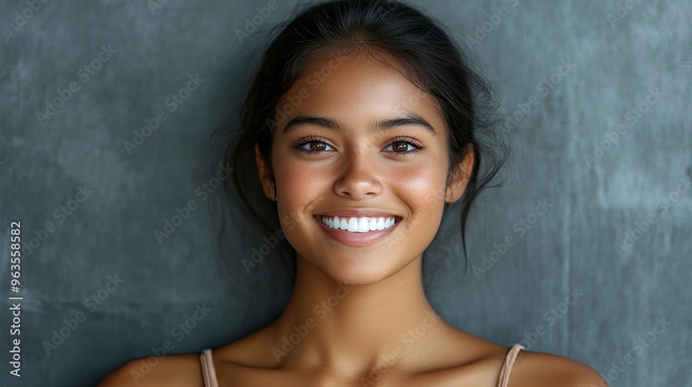 Close up face of young woman with beautiful smile isolated on grey wall with copy space. Successful multiethnic girl. Latin woman looking at camera against gray wall .generative ai Close up face of young woman with beautiful smile isolated on grey wall with copy space. Successful multiethnic girl. Latin woman looking at camera against gray wall .generative ai
