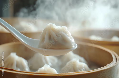 Steamed xiao long bao with soup and pork meat inside them. Steamed baozi, Asian soup dumplings. 