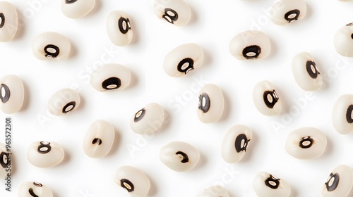 Realistic spread of black-eyed peas on a white background, emphasizing their distinct cream color and dark eye spot with a clean, minimal look photo