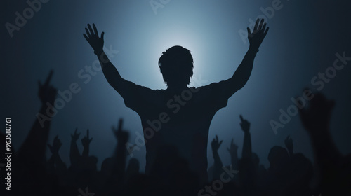 A silhouetted figure raises hands in celebration, surrounded by a crowd, creating an atmosphere of excitement and unity. high quality