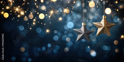 New year, Christmas background with gold and silver stars and Christmas baubles and sparkling. Christmas Golden light shine particles bokeh on light red and blue background.