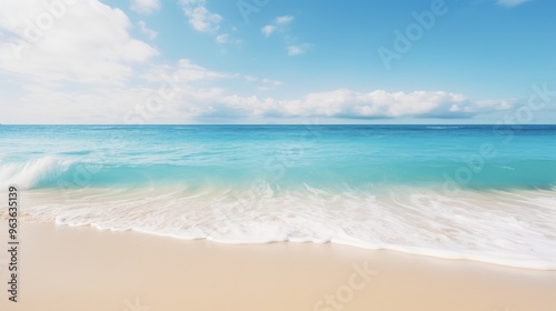 A serene seascape with crystal-clear turquoise water gently lapping onto a pristine white sandy beach.