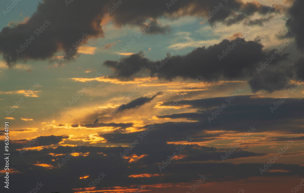 Fototapeta premium cumulonimbus clouds randomly covering the evening sky in the dusk