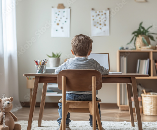 Child Sitting at Desk Near Window